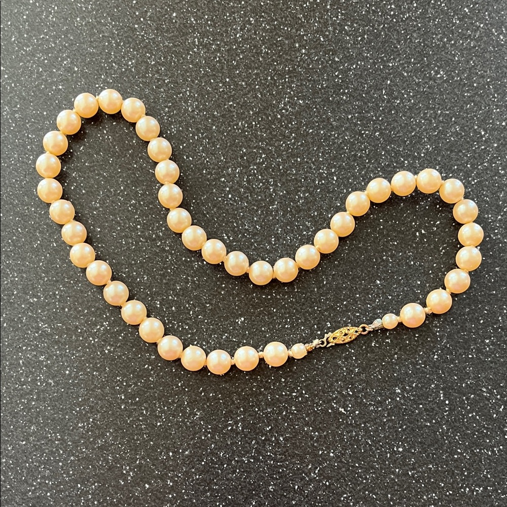 Vintage Princess Cream colored Glass Pearls with a gold tone clasp